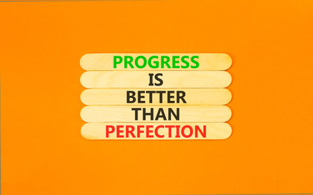 Progress or perfection words symbol. Concept words Progress is better than perfection on beautiful...