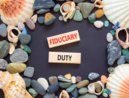 Fiduciary duty words symbol. Concept words Fiduciary duty on beautiful wooden blocks. Beautiful...