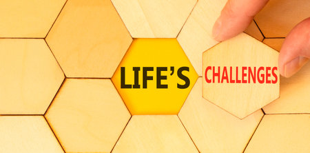 Life's challenges words symbol. Concept words Life's challenges on beautiful wooden puzzles. Beautiful yellow background. Business lifestyle and Life's challenges words concept. Copy space.
