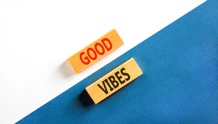 Good vibes words symbol. Concept words Good vibes on beautiful wooden blocks. Beautiful white and blue background. Business lifestyle and Good vibes words concept. Copy space.