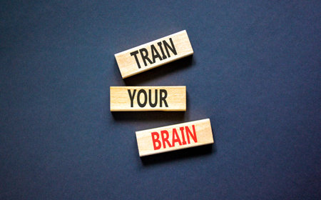 Train your brain words symbol. Concept words Train your brain on beautiful wooden blocks. Beautiful black background. Business motivational and train your brain concept. Copy space