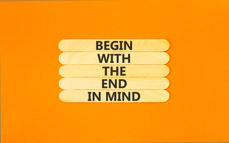 Begin with the end in mind symbol. Concept words Begin with the end in mind on beautiful wooden sticks. Beautiful orange paper background. Business begin with the end in mind concept. Copy space.