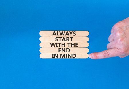 Start with the end in mind symbol. Concept words Always start with the end in mind on beautiful wooden sticks. Beautiful blue background. Business start with the end in mind concept. Copy space.