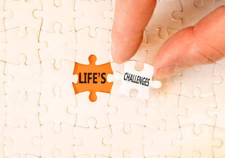 Life's challenges words symbol. Concept words Life's challenges on beautiful white puzzles. Beautiful orange background. Business lifestyle and Life's challenges words concept. Copy space.