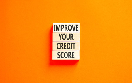 Improve your credit score words symbol. Concept words Improve your credit score on beautiful wooden blocks. Beautiful orange background. Business improve your credit score concept. Copy space.