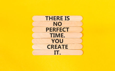 No perfect time words symbol. Concept words There is no perfect time. You create it on beautiful wooden sticks. Beautiful yellow background. Business and no perfect time concept. Copy space.