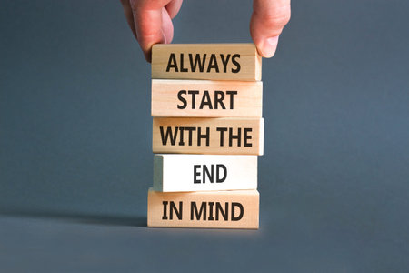 Start with the end in mind symbol. Concept words Always start with the end in mind on beautiful wooden blocks. Beautiful grey paper background. Business start with the end in mind concept. Copy space.