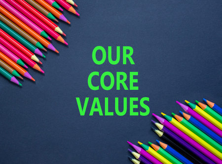 Our core values symbol. Concept words Our core values on beautiful black paper. Beautiful black background. Beautiful colored pencils. Business our core values motivational support concept. Copy space