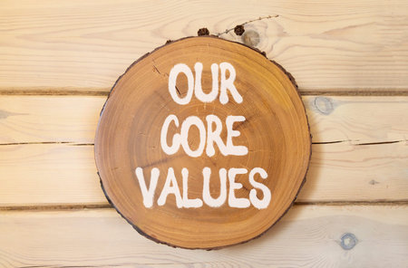 Our core values words symbol. Concept words Our core values on beautiful wooden circle. Beautiful wooden wall background. Business our core values motivational support concept. Copy space.