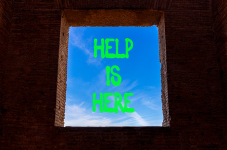 Help is here and support words symbol. Concept words Help is here on beautiful window. Beautiful blue sky background. Business help is here and support concept. Copy space.