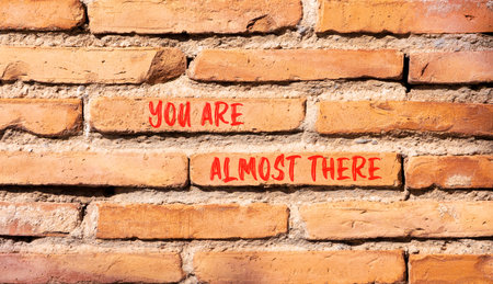 You are almost there words symbol. Concept words You are almost there on beautiful brick wall. Beautiful brick wall background. Business You are almost there motivational support concept. Copy space.