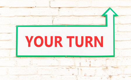 Your turn words symbol. Concept words Your turn on beautiful white sign plate. Beautiful white brick wall background. Business your turn motivational support concept. Copy space.