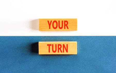 Your turn words symbol. Concept words Your turn on beautiful wooden blocks. Beautiful blue white background. Business your turn motivational support concept. Copy space.