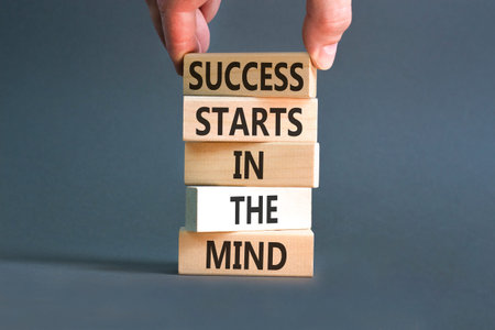 Success starts in the mind symbol. Concept words Success starts in the mind on beautiful wooden blocks. Beautiful grey background. Business and success starts in the mind concept. Copy space.