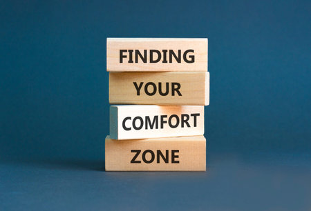 Finding your comfort zone words symbol. Concept words Finding your comfort zone on beautiful wooden blocks. Beautiful grey background. Psychological finding your comfort zone concept. Copy space.