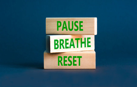 Pause breathe reset words symbol. Concept words Pause breathe reset on beautiful wooden blocks. Beautiful grey background. Business support motivational and pause breathe reset concept. Copy space.