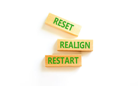 Reset realign restart words symbol. Concept words Reset realign restart on beautiful wooden blocks. Beautiful white background. Business motivational and reset realign restart concept. Copy space.