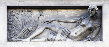 Bas-relief on an old building - stylized girl with a pheasant in Lviv, Ukraineの写真素材