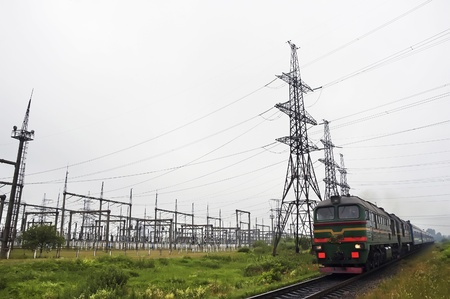Electric transmission line, rails and the train