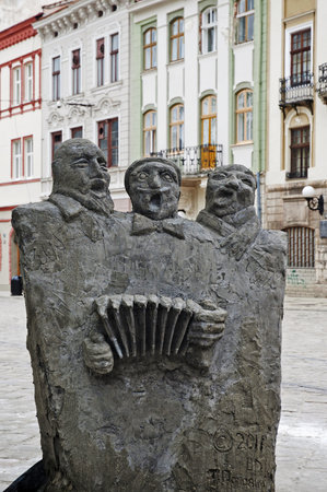 LVIV; UKRAINE - MAY 04, 2011:  Sculpture - Three merry friend. Author sculptures T. Popovic.のeditorial素材