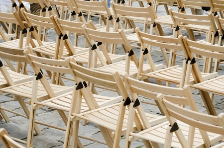 Empty wooden chairs on the pavementの写真素材