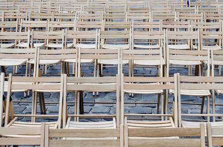 Empty wooden chairs on the pavementの写真素材