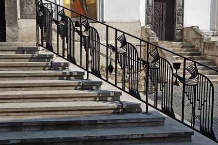 Forged railing in the form of monks in Monastery St.Onufriy in Lvov, Ukraine