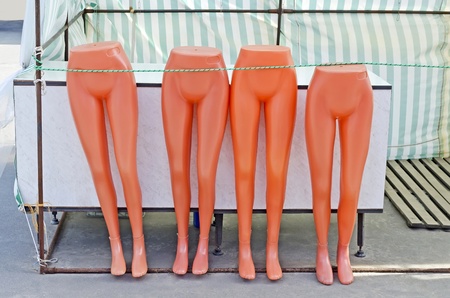 Legs mannequins are standing next to the counterの写真素材
