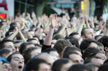 Thousands of people came to the fan zone in Lvov to watch a football match Ukraine - France in the Euro 2012 on June 15, 2012 in Lvov, Ukraine. のeditorial素材