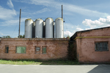 Industrial background - small old factory building close-upのeditorial素材