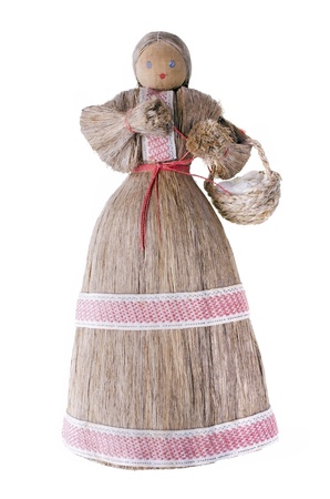 Ukrainian traditional souvenir - a girl doll of straw, isolated over whiteの写真素材
