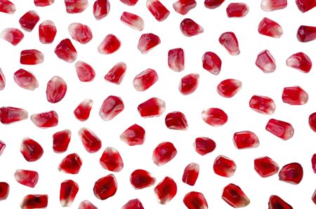 Food background - Pomegranate seeds closeup, isolated over whiteの写真素材