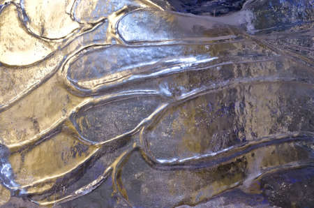 Abstract background - texture surface of ice blocks to the lightの写真素材