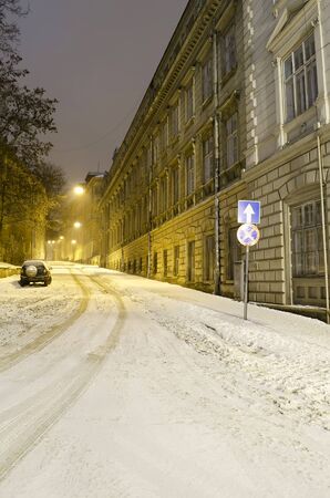 Beautiful winter cityscape at the night - old street in Lvovの写真素材