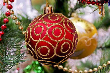 New Year background - beautiful toys on a Christmas tree - two Christmas ball close-upの写真素材