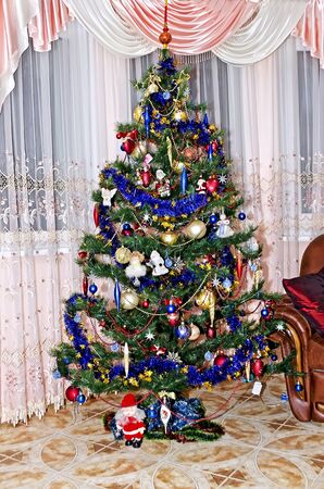 New Year background - Christmas tree decorated with toysの写真素材