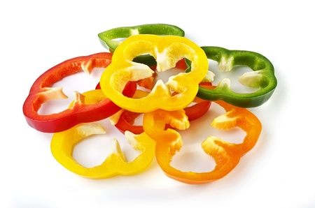Sliced sweet colorful peppers close-up, isolated on a white backgroundの写真素材