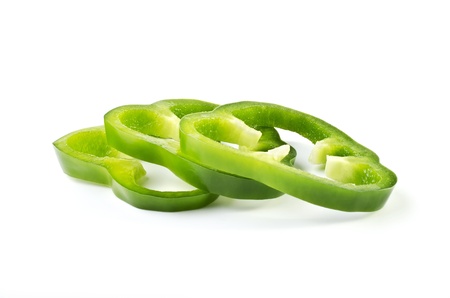 Three pieces of chopped sweet green pepper, isolated on a white backgroundの写真素材