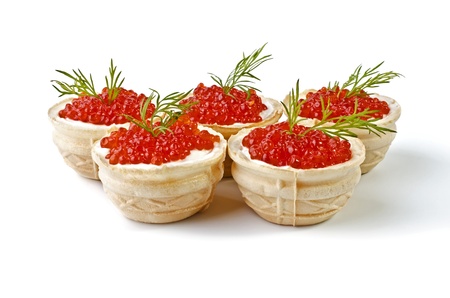 Delicatessen appetizer - red caviar in tartlet, isolated on a white backgroundの写真素材