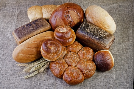 Assortment of baked goods close-up, lying on sackingの写真素材