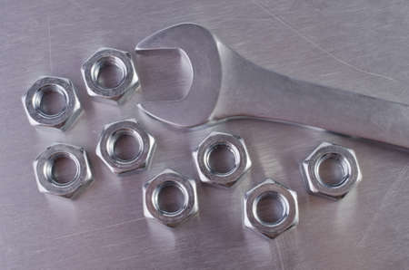 Metal nut and wrench close-upの写真素材