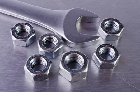 Metal nut and wrench close-upの写真素材