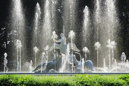 Beautiful fountain, decorated with a sculpture - a boy and a swans in Lvov, Ukraineの写真素材