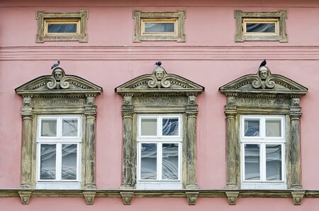 Three windows on the facade of an old building in Lvov, Ukraineの写真素材