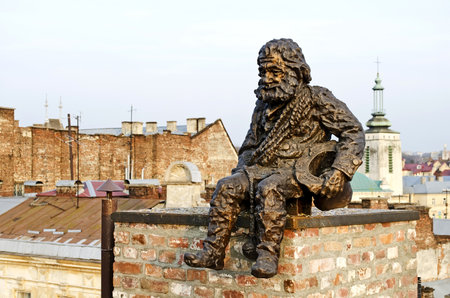 Lvov, Ukraine - APRIL 24, 2013: Sculpture a chimney sweep on the roof of the House of Legends on April 24, 2013 in Lviv, Ukraine. Lvov is recognized as the most attractive city for tourists in Ukraineのeditorial素材