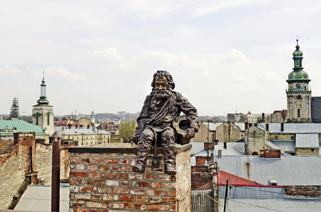 Lvov, Ukraine - APRIL 25, 2013: Sculpture a chimney sweep on the roof of the House of Legends on April 25, 2013 in Lviv, Ukraine. Lvov is recognized as the most attractive city for tourists in Ukraineのeditorial素材