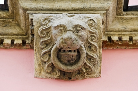 Mascaron - sculpture of the head of a lion on the facade of the old house in Lvov, Ukraineの写真素材