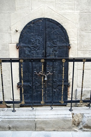 The old wrought iron door close-upの写真素材