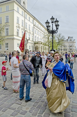 LVOV, UKRAINE - APRIL 24: Lviv have a Hare Krishna who arrange songs and dances in the center of town on April 24, 2013 in Lviv, Ukraineのeditorial素材