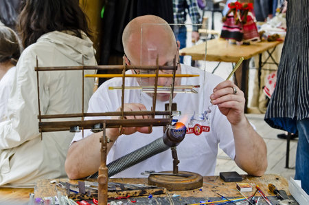 LVOV, UKRAINE - APRIL 28: Jeweler holds a master class in the center of the city of Lviv during the...